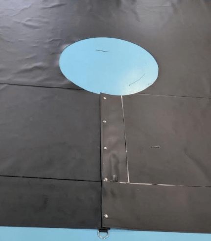 Black tarp with circle cutout