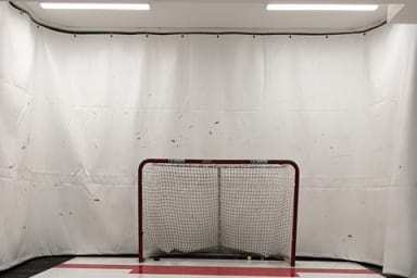 Tarp used as a background in hockey practice