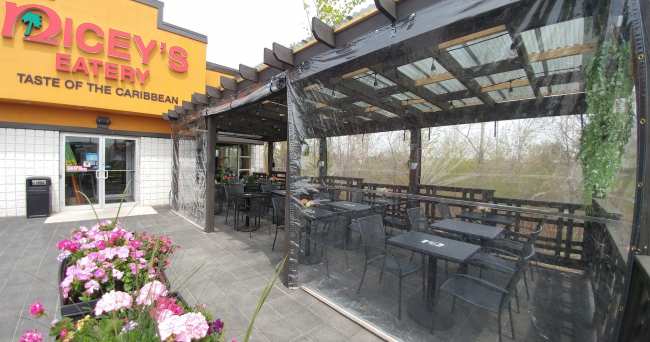 Clear roll-up tarps used for restaurant patio