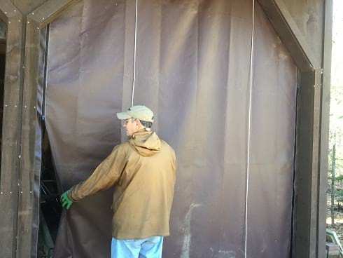 Roll-up shed door tarp