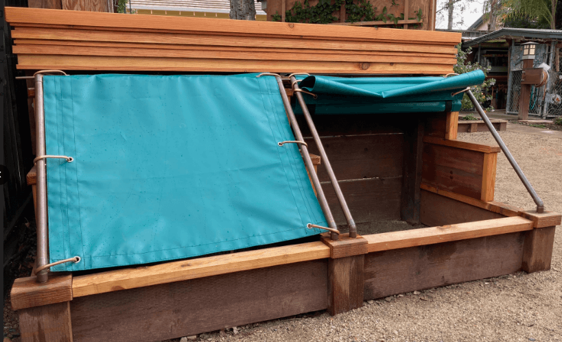 Sliding stoage bin tarp