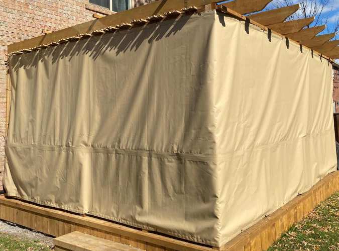 Sukkah with tan tarp covering