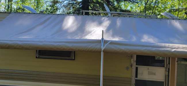Trailer awning with center support