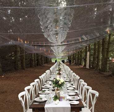 Tarps used to keep guests dry at a wedding